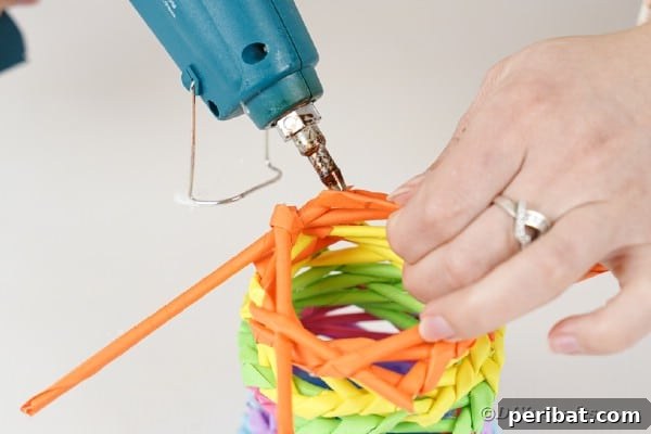 Vibrant DIY Paper Straw Desk Caddy 37 Gluing straws in place