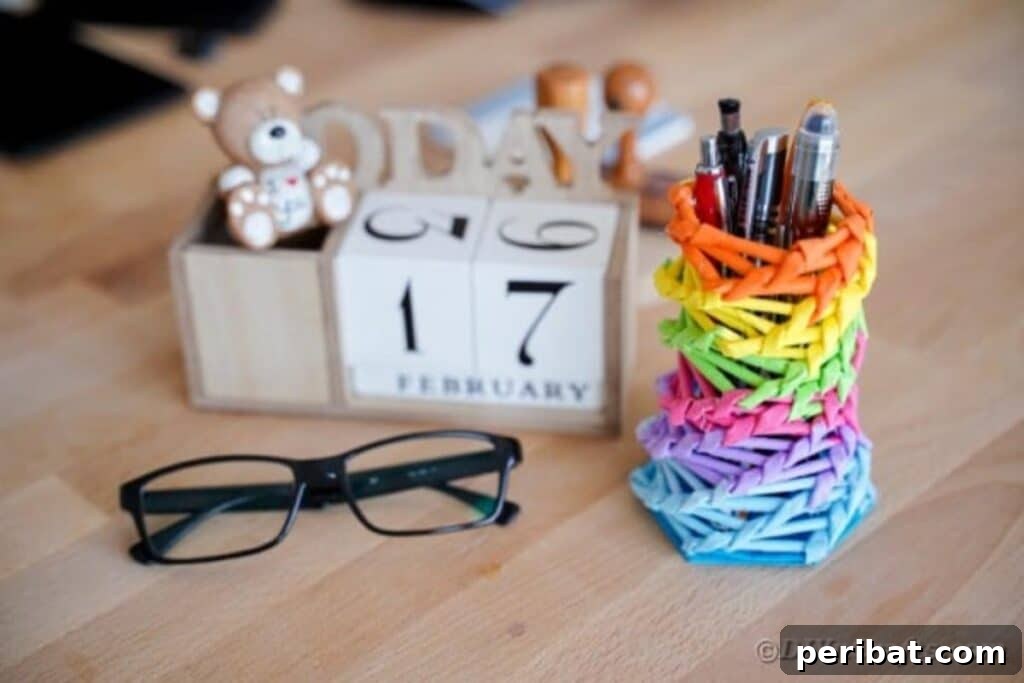 Vibrant DIY Paper Straw Desk Caddy 40 Rainbow pencil holder on desk by block calendar, close-up
