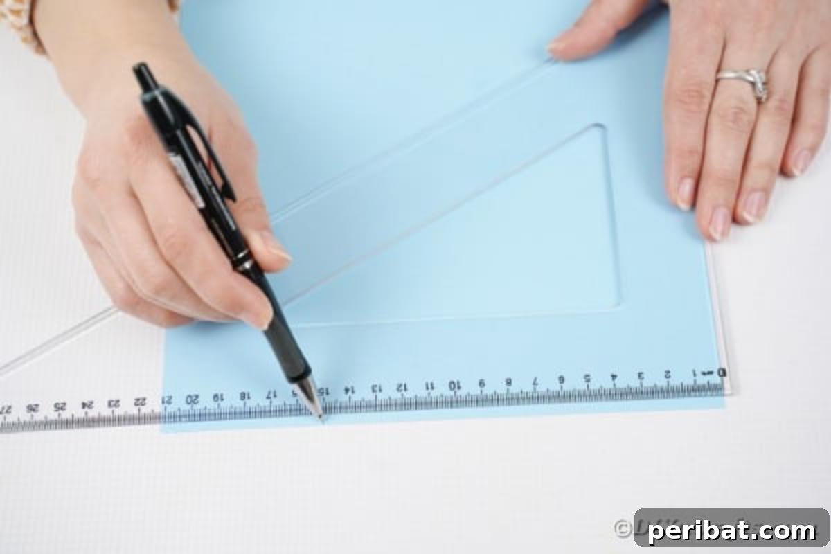 Vibrant DIY Paper Straw Desk Caddy 7 A hand holding a ruler and pen, tracing a line on a piece of paper to divide it for the craft project.