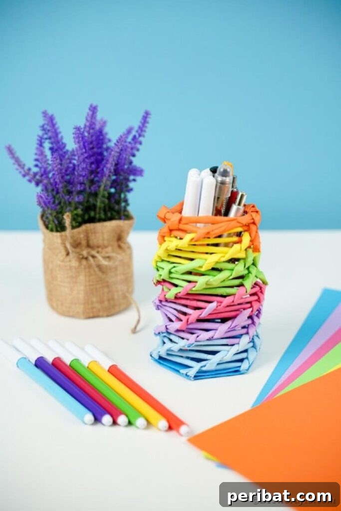 Vibrant DIY Paper Straw Desk Caddy 44 Straw Rainbow Organizer can next to a lavender plant for aesthetic appeal.
