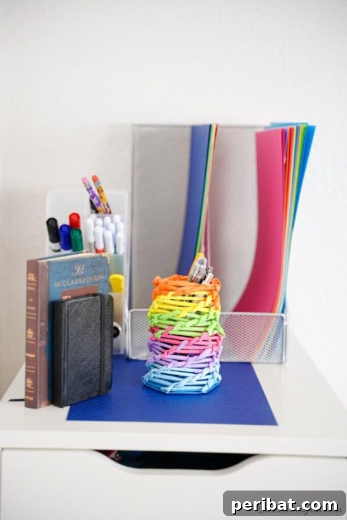 Vibrant DIY Paper Straw Desk Caddy 45 Rainbow organizer can holding pens on a desk with various papers