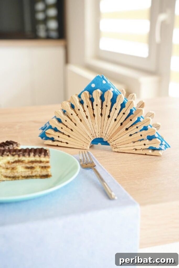 Chic Repurposed Clothespin Napkin Rack 20 The napkin holder sits beside a plate of delicious desserts, illustrating its practical use during gatherings.