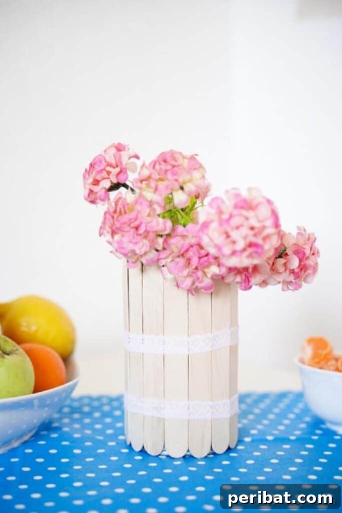 Transform Tin Cans into a Rustic Craft Stick Organizer Video Tutorial 22 Craft stick can on blue and white polka dot fabric