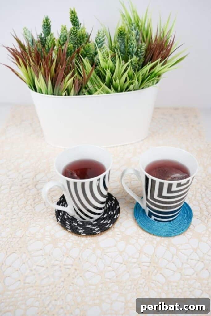 Black and white and blue coaster on table by potted plant