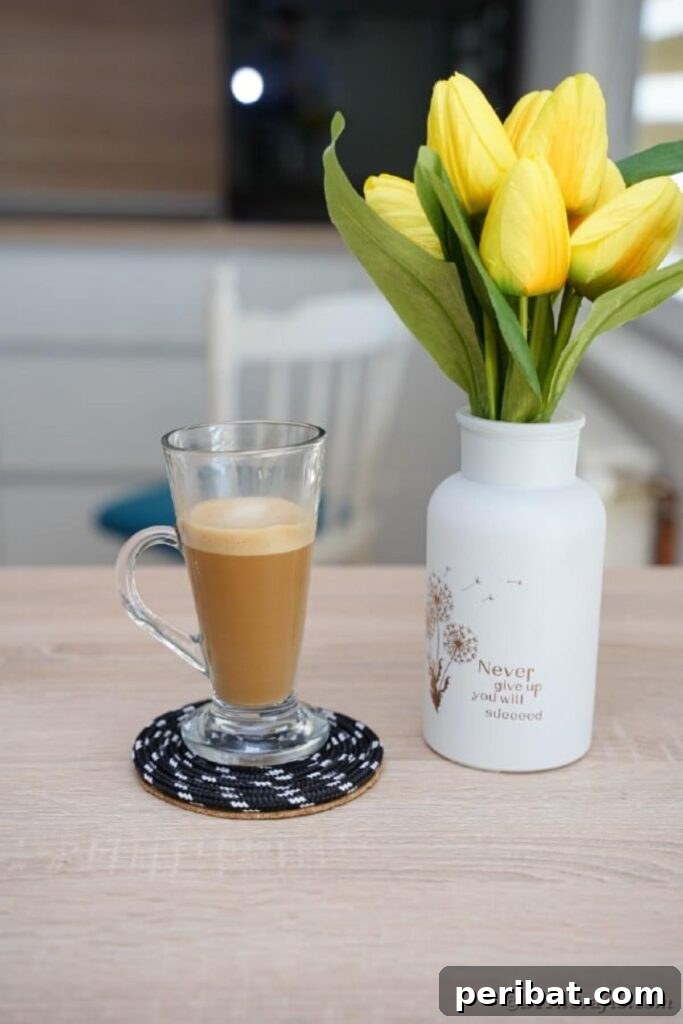 all glass of coffee on black rope coaster