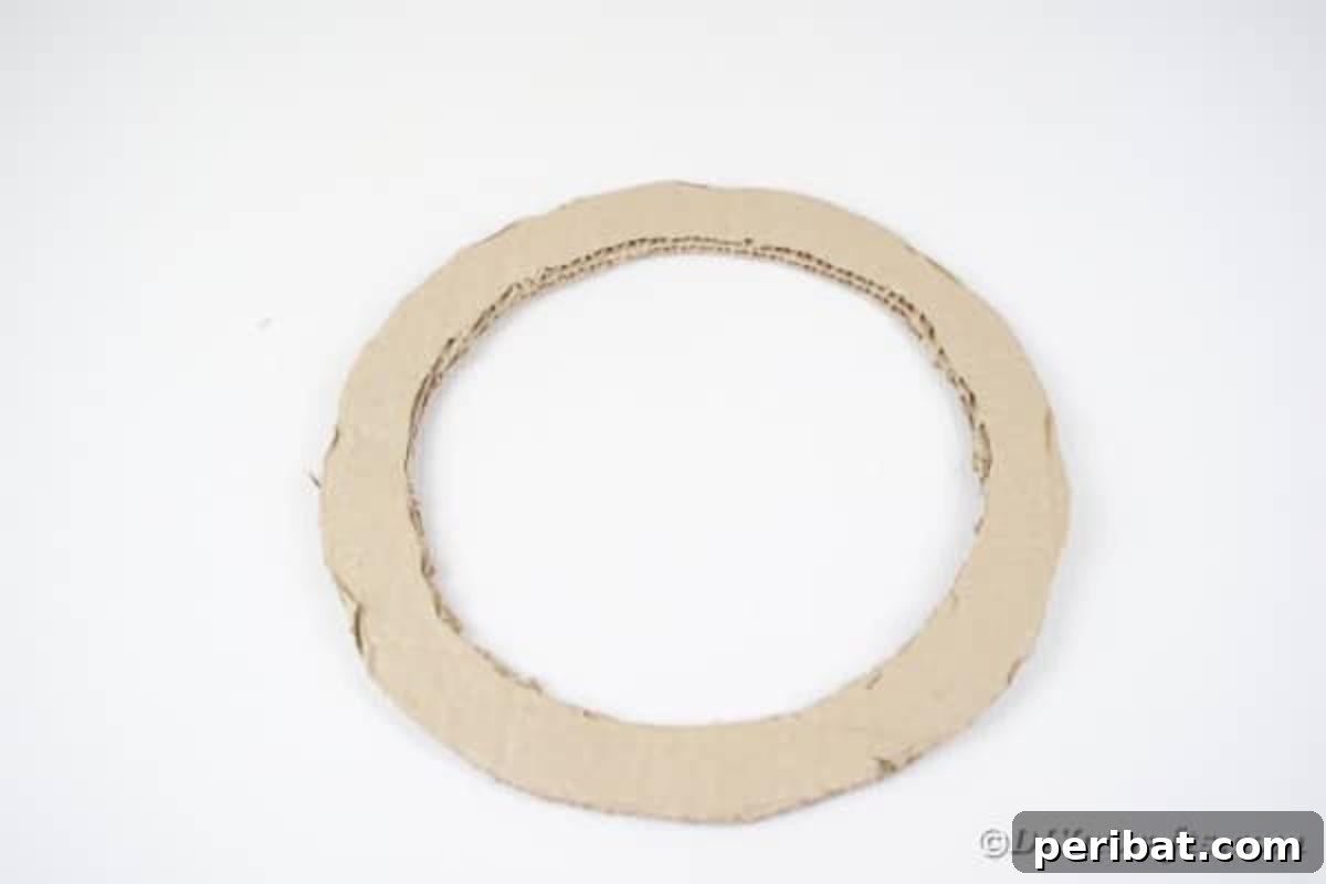 Artful Scroll Wreath from Repurposed Book Pages 11 Cutting center out of cardboard