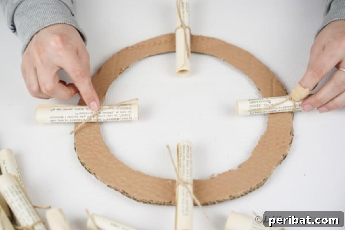 Artful Scroll Wreath from Repurposed Book Pages 17 Gluing paper scrolls to cardboard