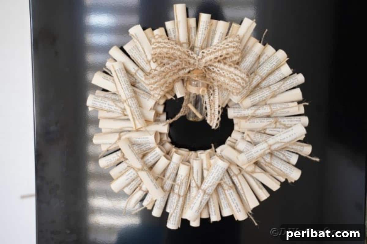 Artful Scroll Wreath from Repurposed Book Pages 5 Scroll wreath hanging on window
