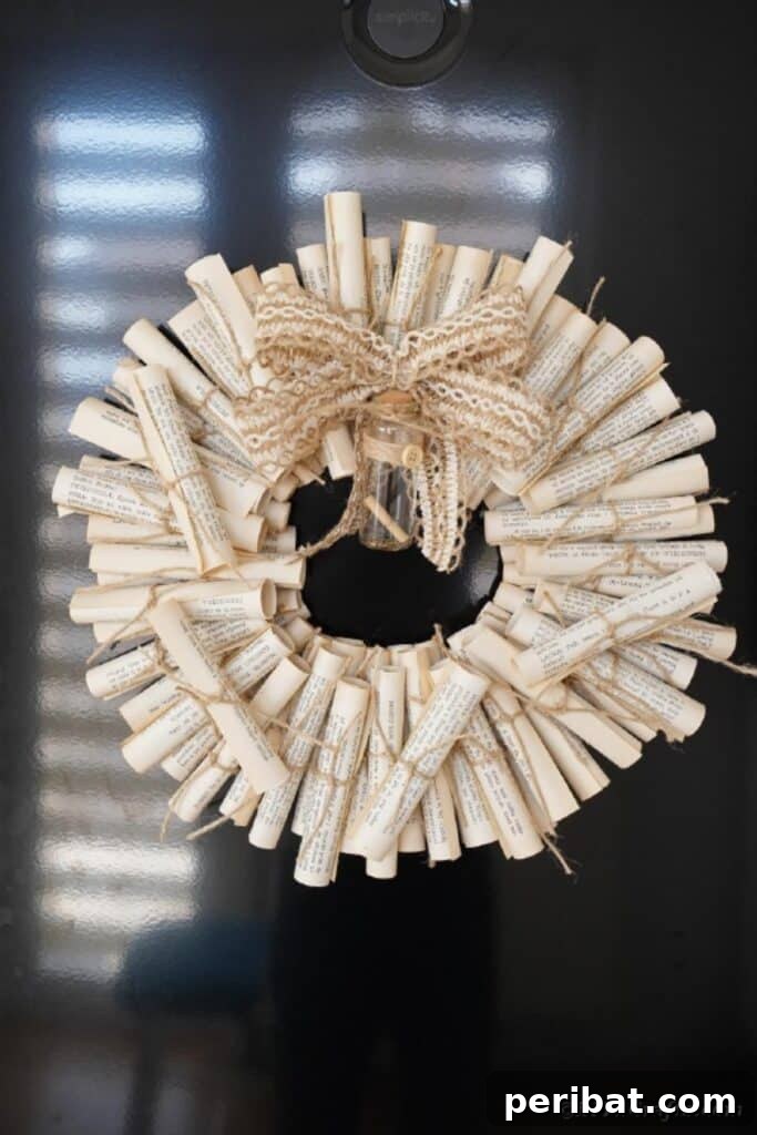 Artful Scroll Wreath from Repurposed Book Pages 28 Scroll wreath hanging on window