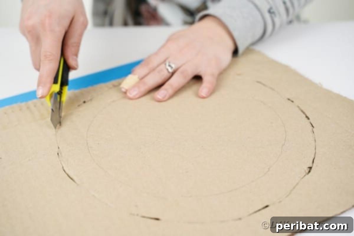 Artful Scroll Wreath from Repurposed Book Pages 10 Cutting circle out of cardboard