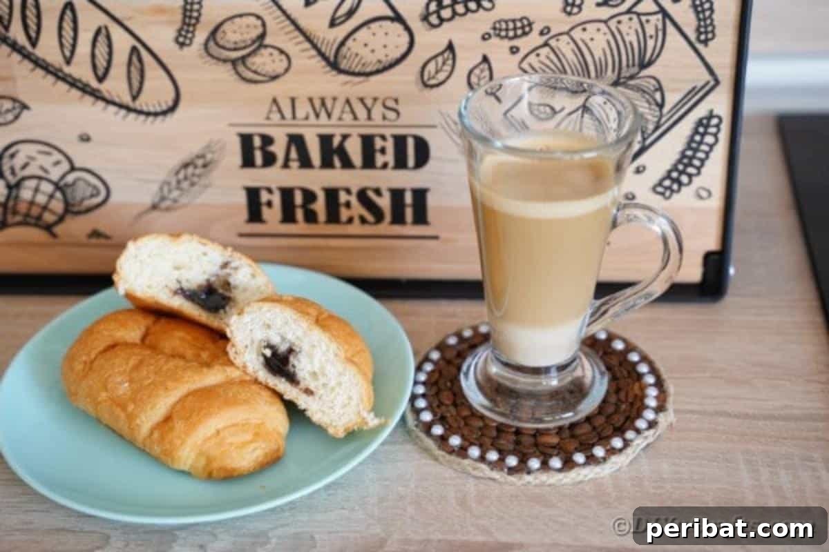A charming coffee bean coaster placed on a wooden table in front of a rustic bread box, adding cozy farmhouse style.