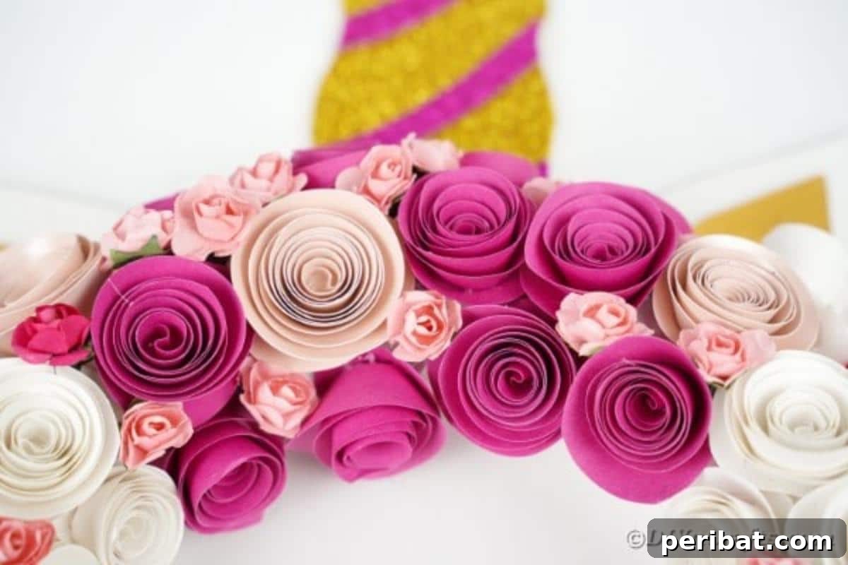 Enchanting Quilled Unicorn Wreath 5 A charming paper unicorn wreath with intricate flowers and a glittery horn, subtly lit and displayed on a rustic brick wall, emphasizing its handmade appeal.