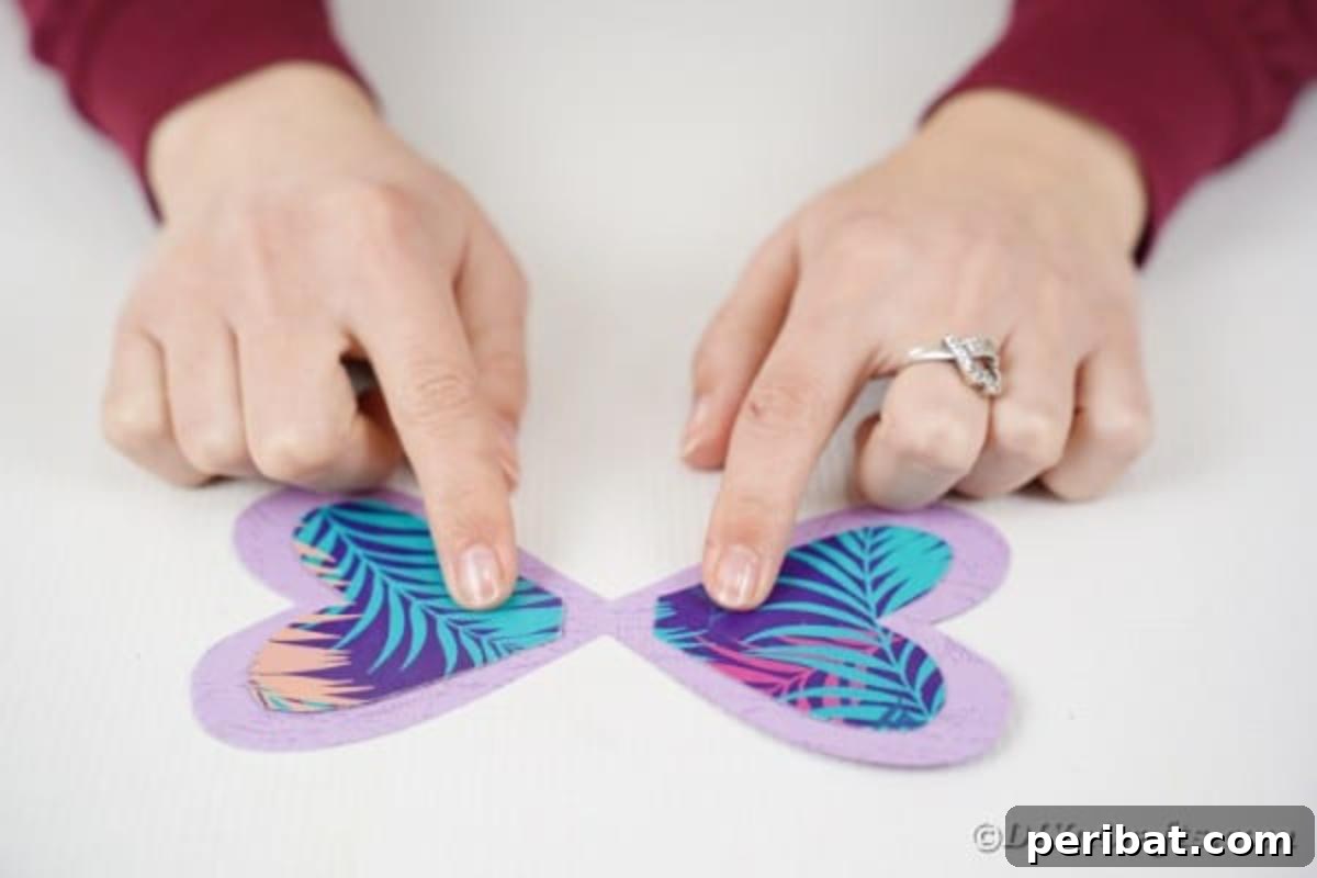 A pair of beautifully completed butterfly wings, showcasing the layered paper design and meticulous symmetry.