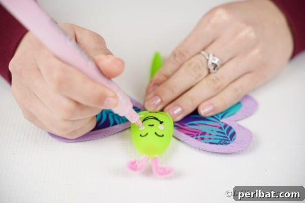 Adding face on butterfly spoon