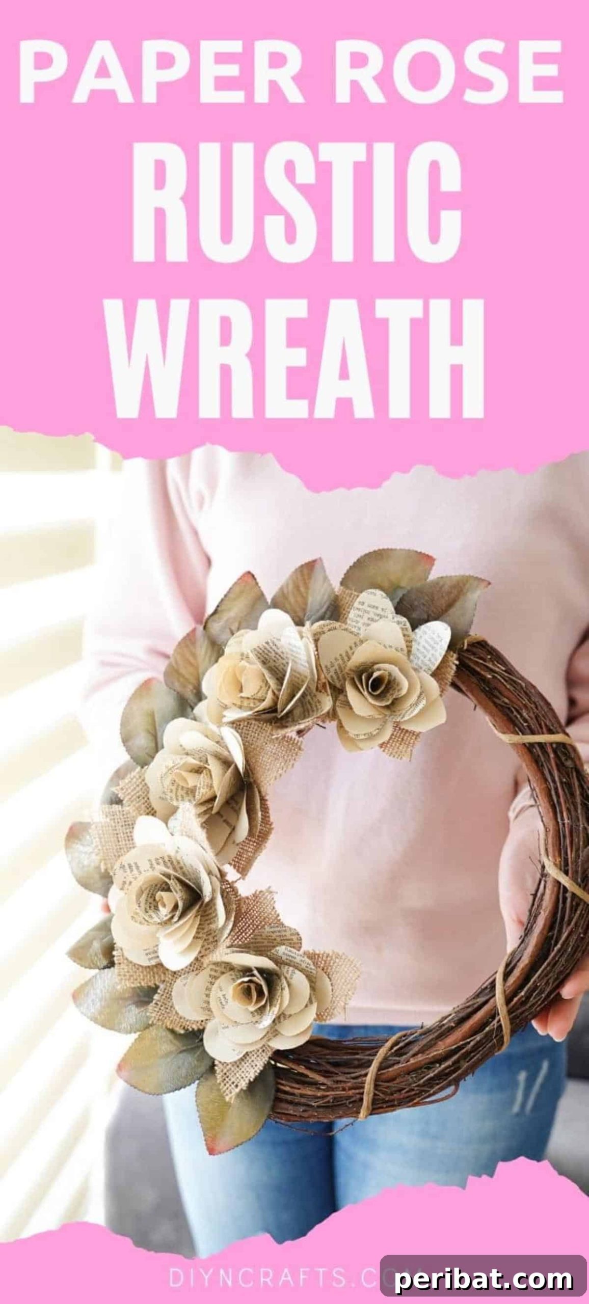Woman holding a finished book page rose wreath, showcasing its rustic beauty.