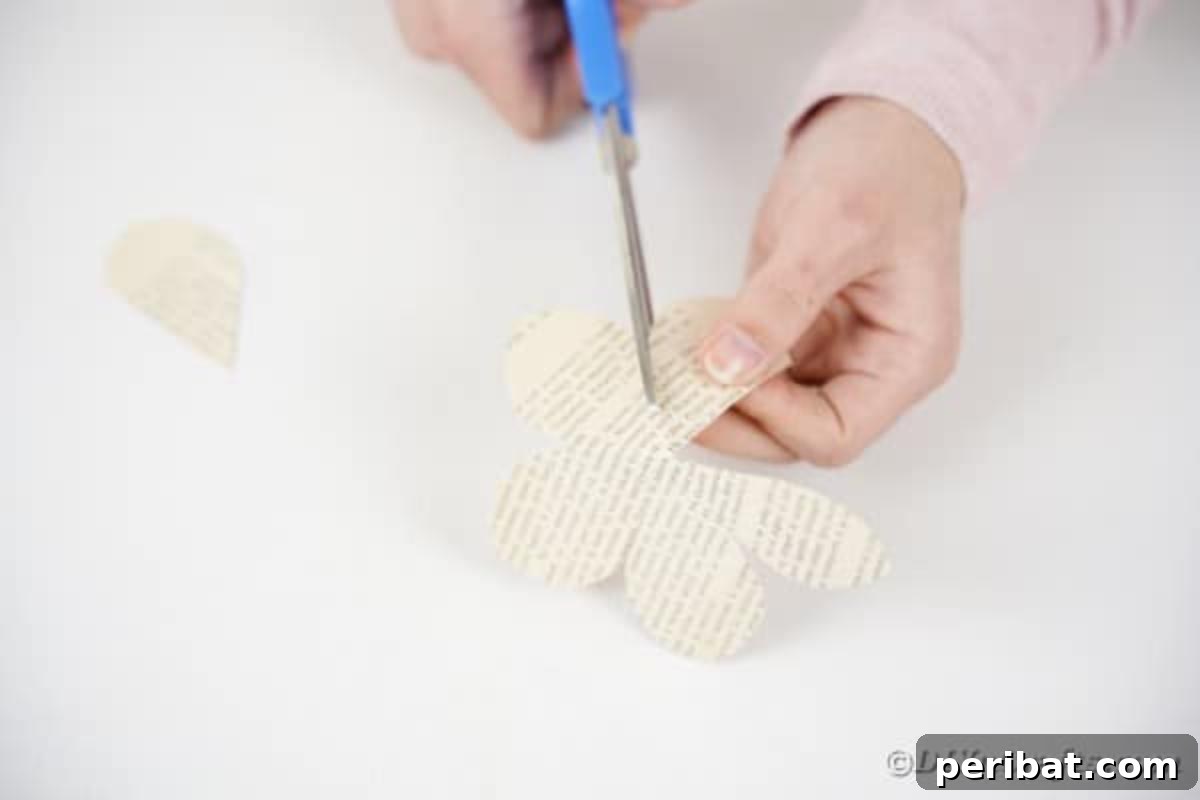 Separated paper rose pieces, showing individual petals and larger sections.