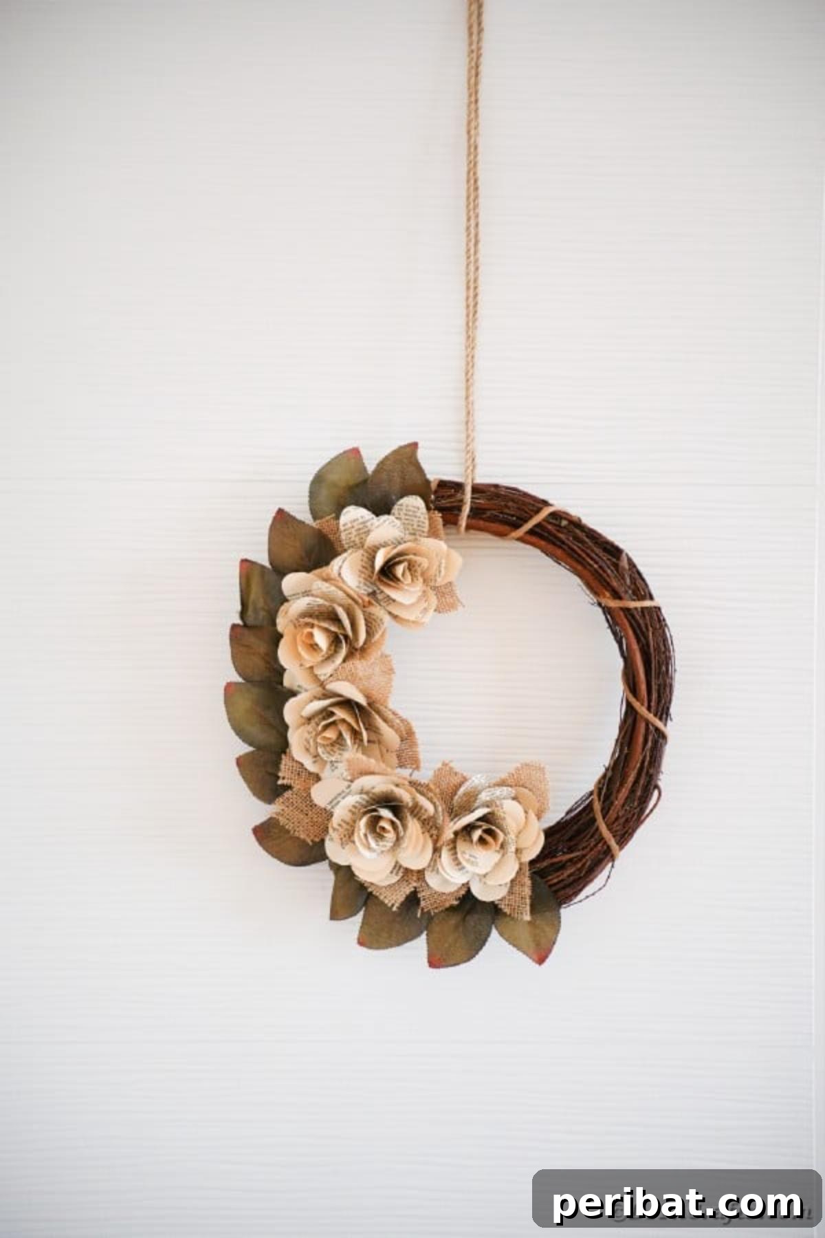 A finished book page wreath against a clean white background, showcasing its elegant simplicity.
