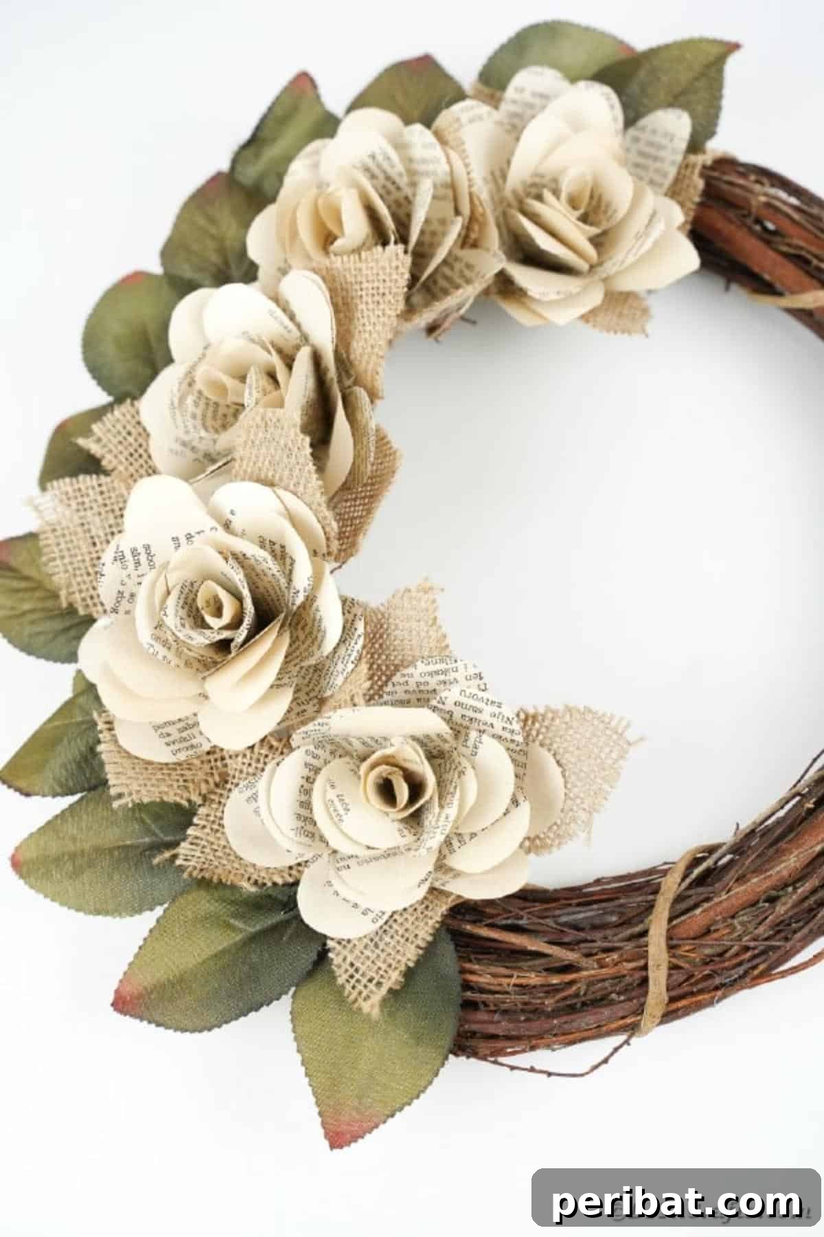 A beautifully crafted book page wreath displayed against a pristine white background, emphasizing its intricate details.