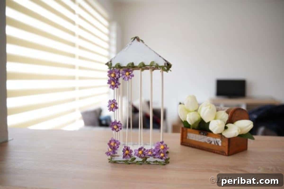 Crafting a Beautiful Floral Birdcage Display 3 DIY Birdcage on Table by Tulips - A white decorative birdcage adding a touch of spring to a tabletop.