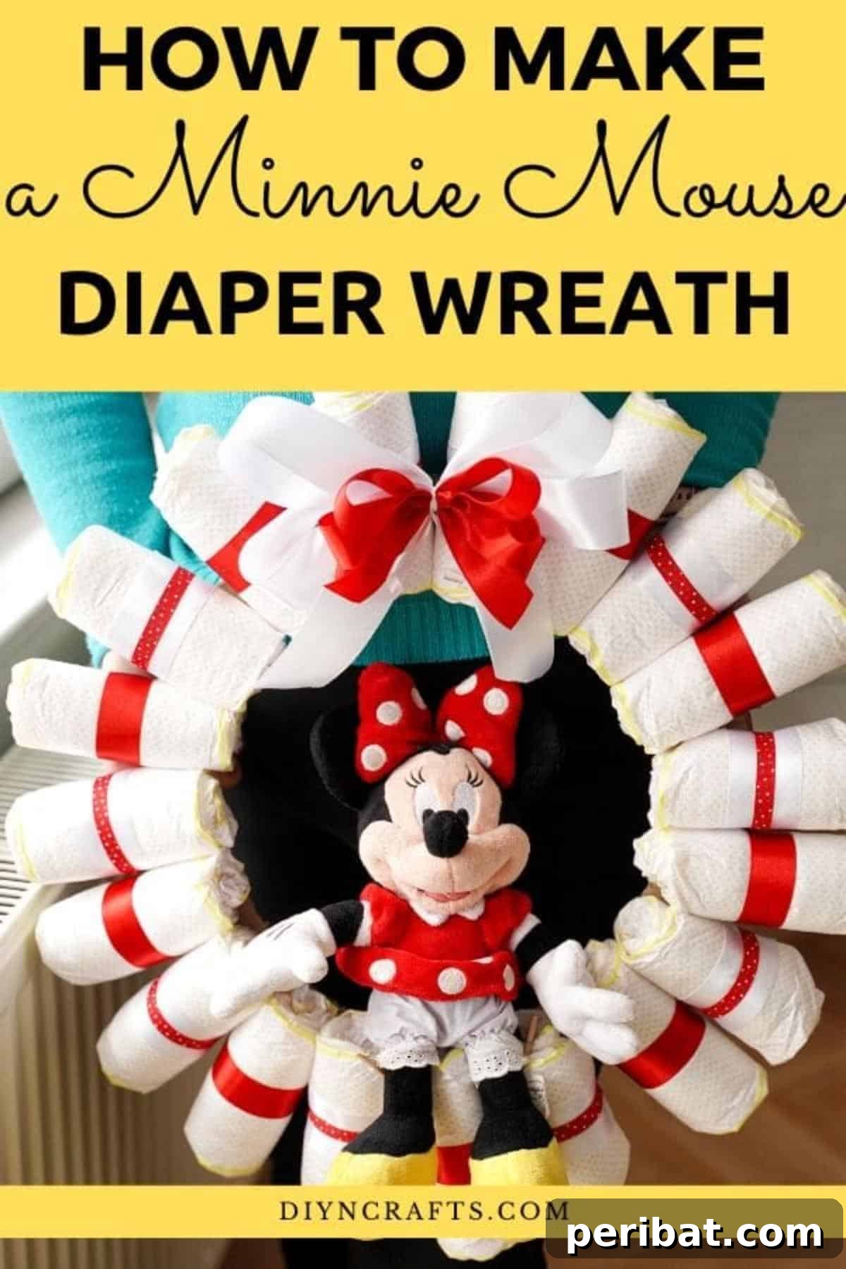 Woman holding a charming Minnie Mouse diaper wreath, perfect for a baby shower gift