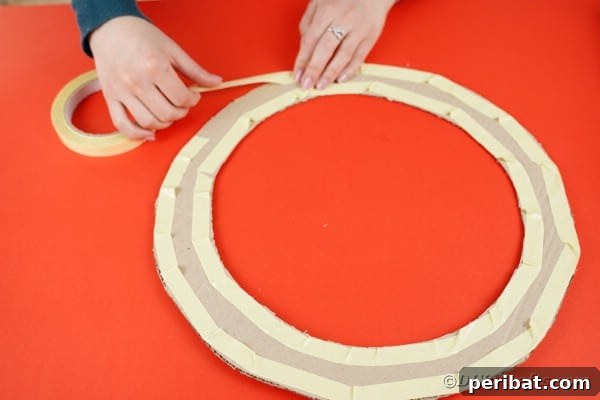 Adding sticky tape to wreath form