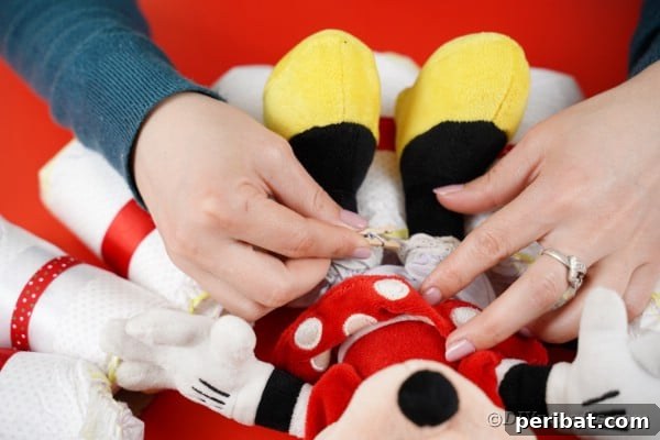 Tying minnie mouse to diaper wreath