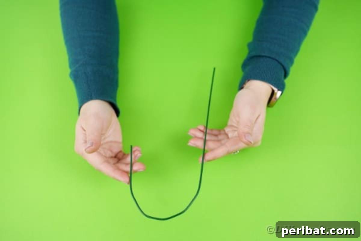 Charming Handmade Diaper Tub Shower Present 14 Hands demonstrating the bending of floral wire into a hook shape for a craft