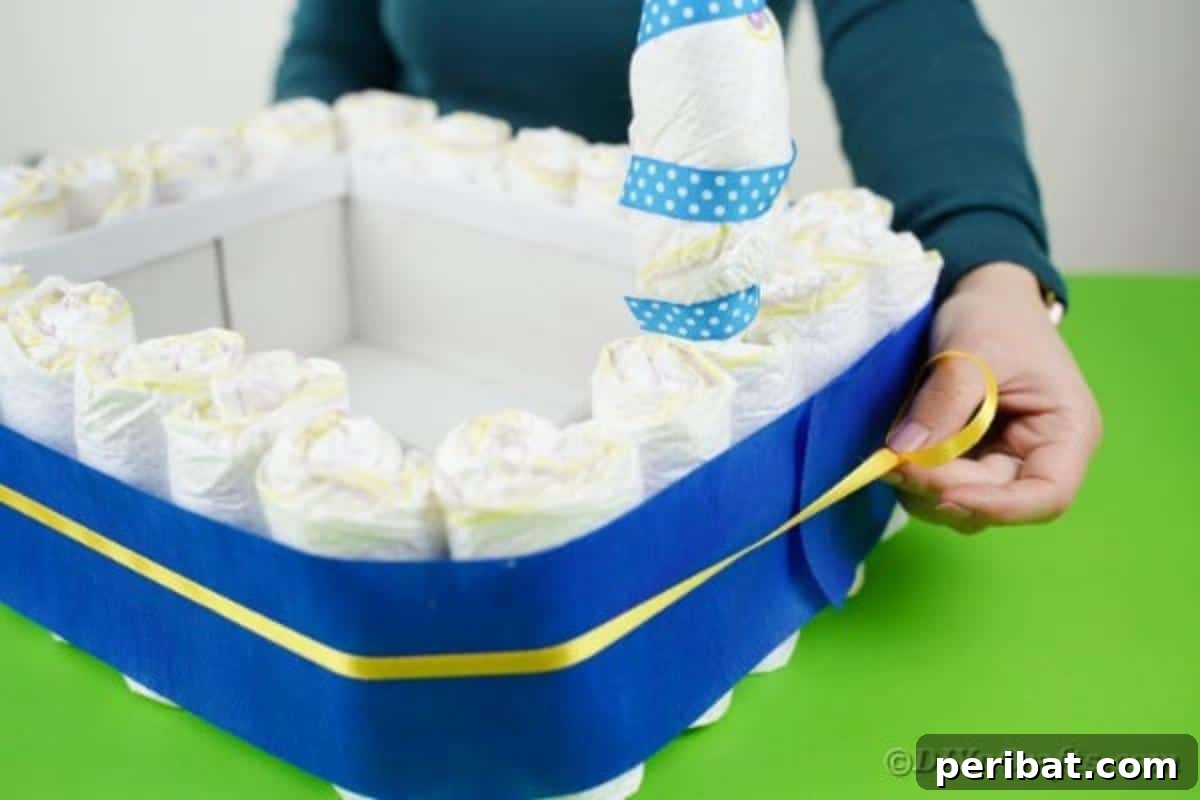 Charming Handmade Diaper Tub Shower Present 19 Securing a thin yellow ribbon around the blue tissue paper on the diaper box