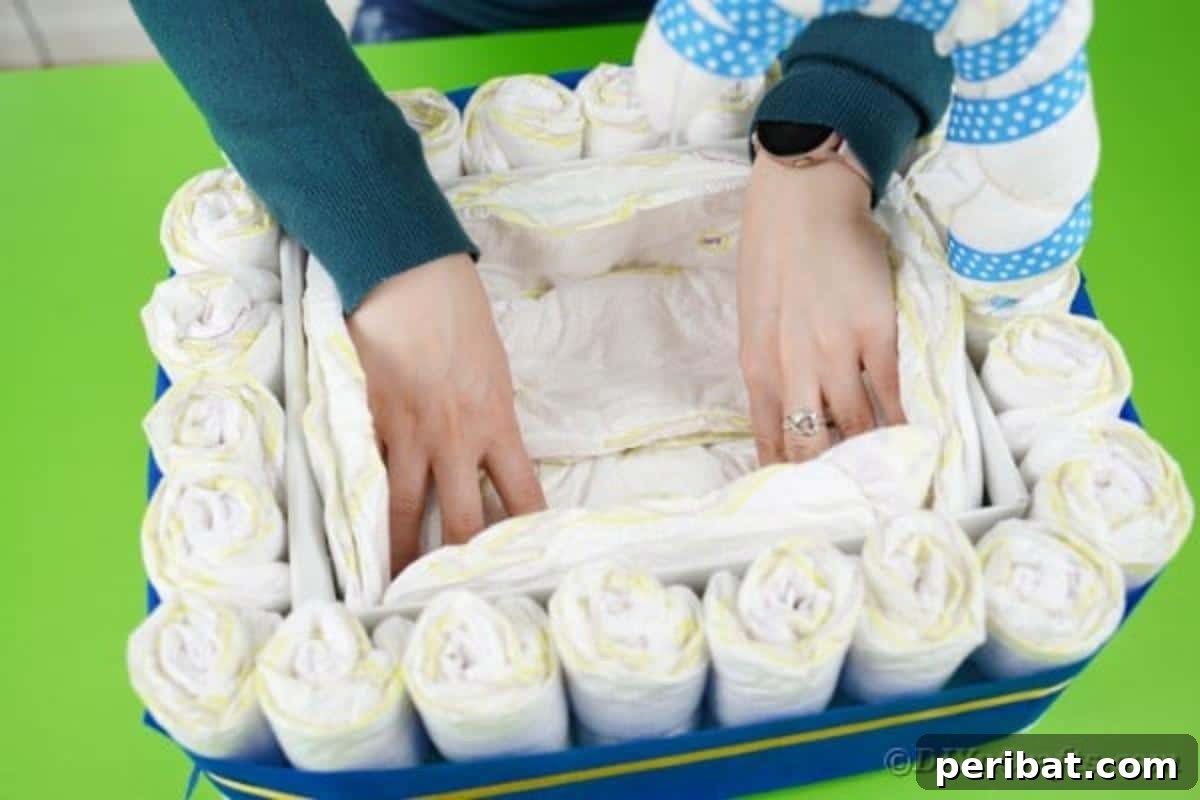 Charming Handmade Diaper Tub Shower Present 20 Lining the interior of the box with unfolded diapers to create a soft base