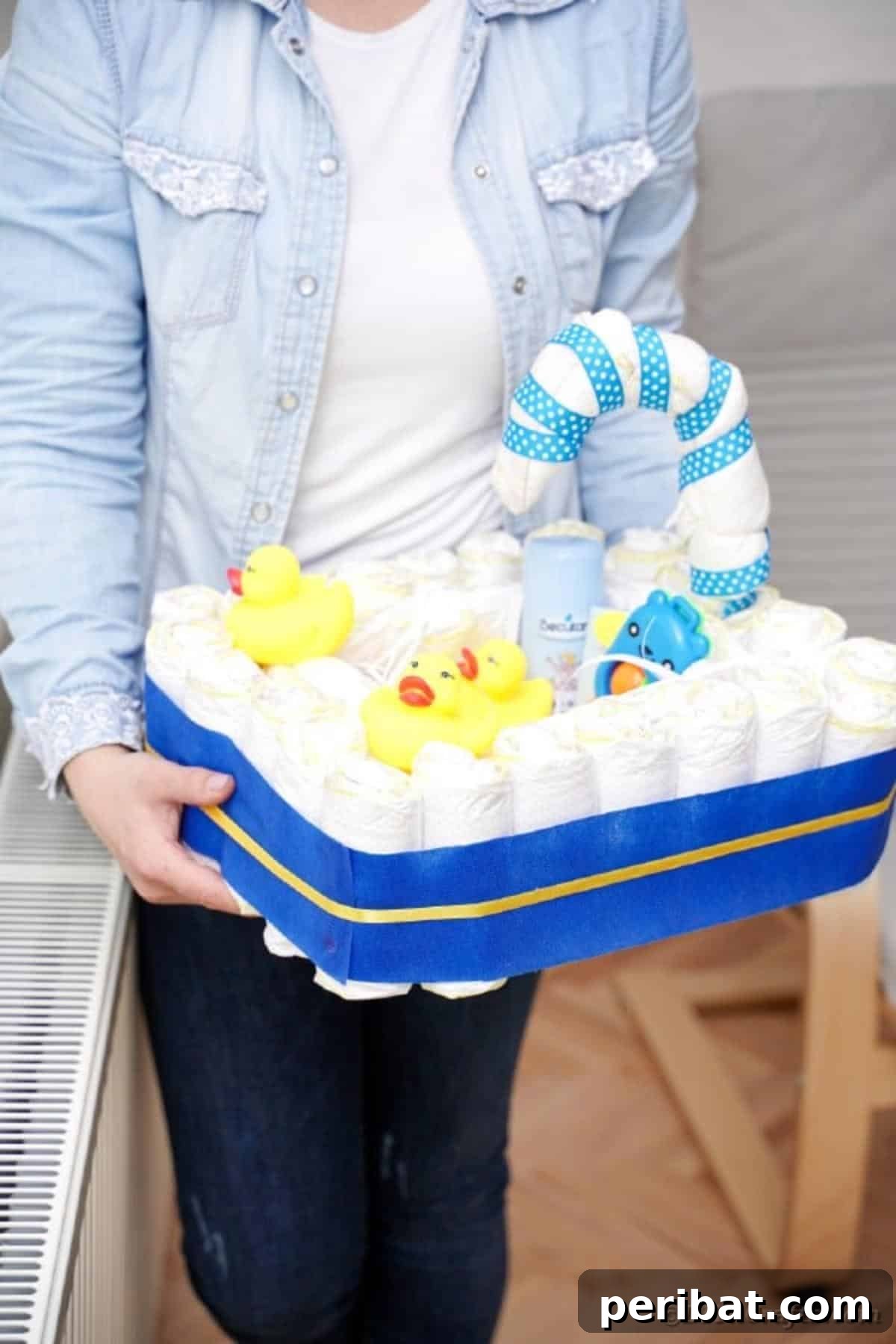 Charming Handmade Diaper Tub Shower Present 23 Woman proudly showcasing her finished diaper baby bathtub gift