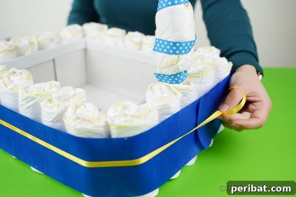 Charming Handmade Diaper Tub Shower Present 33 Adding thin yellow ribbon around the diaper box