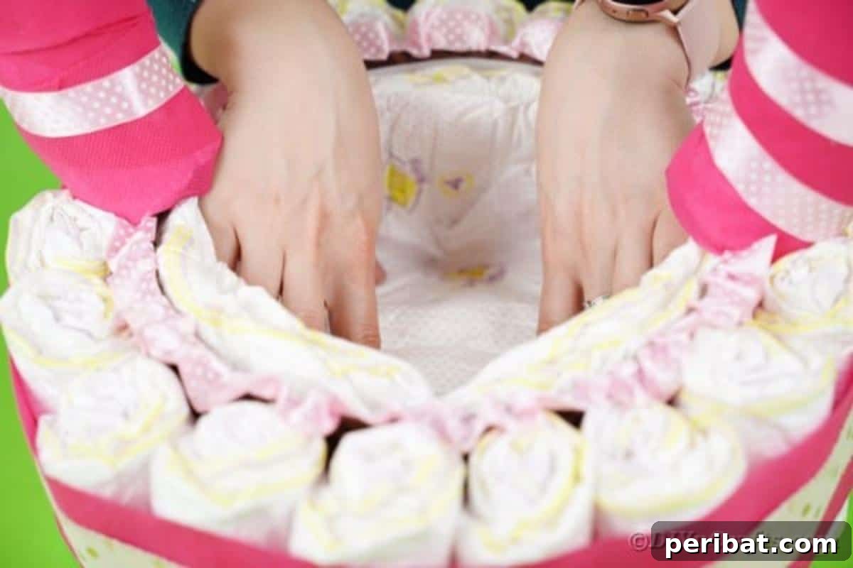 Charming Pink Handmade Diaper Basket Baby Shower Present 23 Placing additional diapers inside the baby basket to create an inner lining and support