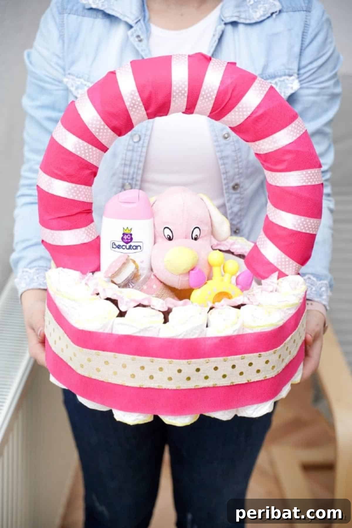Charming Pink Handmade Diaper Basket Baby Shower Present 25 A woman holding the beautifully finished baby diaper basket, ready for gifting at a baby shower