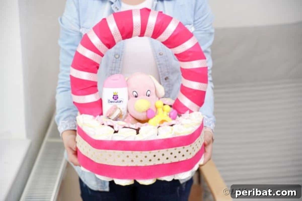 Charming Pink Handmade Diaper Basket Baby Shower Present 5 A woman proudly holding a beautifully finished DIY pink baby diaper basket gift with a happy expression