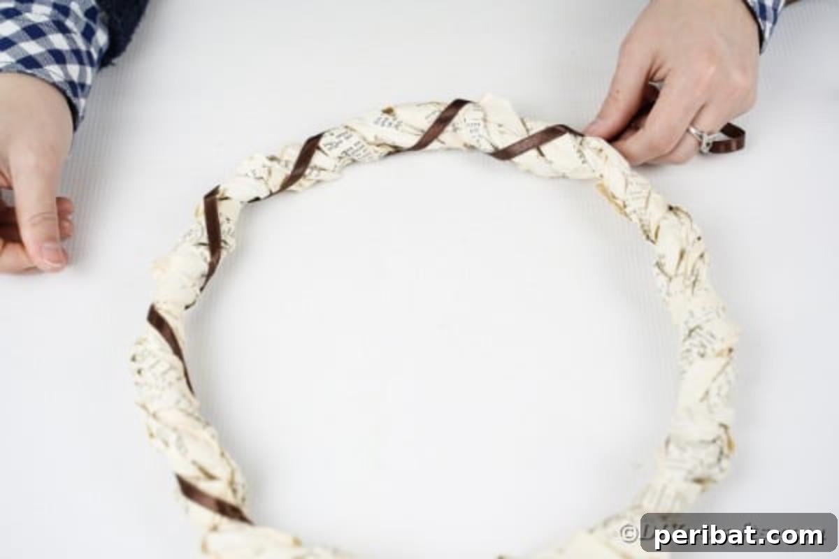 Gluing ribbon to book page wreath