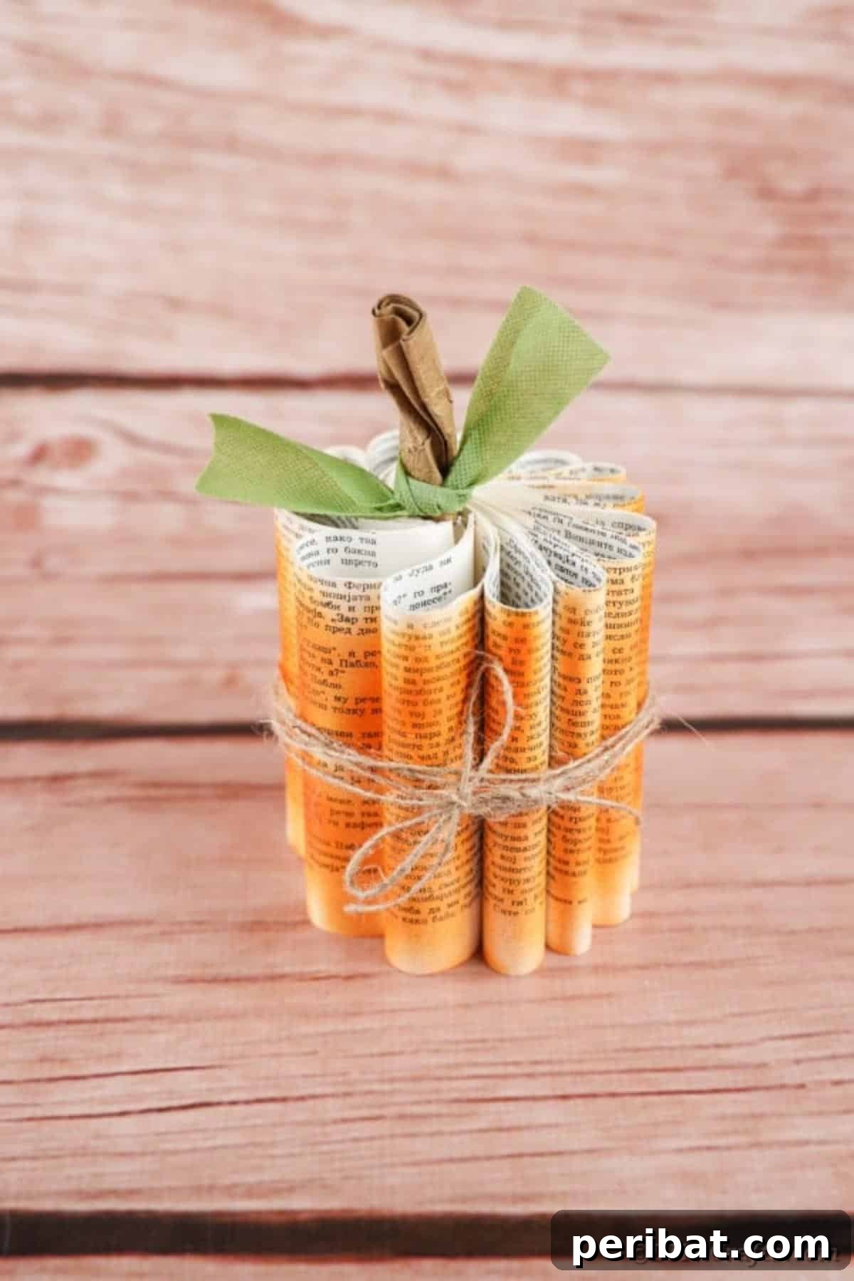 Storybook Pumpkin Charm 30 A beautifully customized paper pumpkin with subtle embellishments, resting against a rustic wooden background.