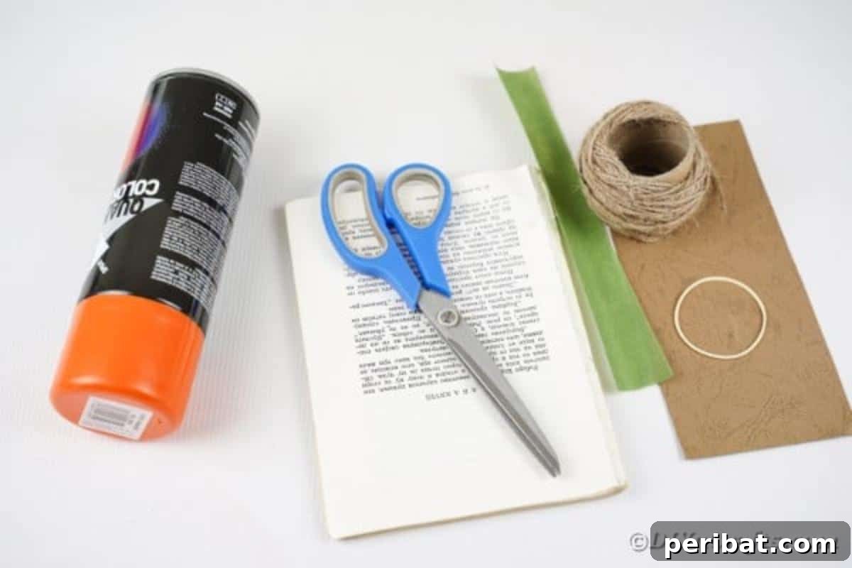 Storybook Pumpkin Charm 4 A flat lay photograph of all the supplies needed to create a book page paper pumpkin, including old book pages, paint, scissors, twine, and craft paper.