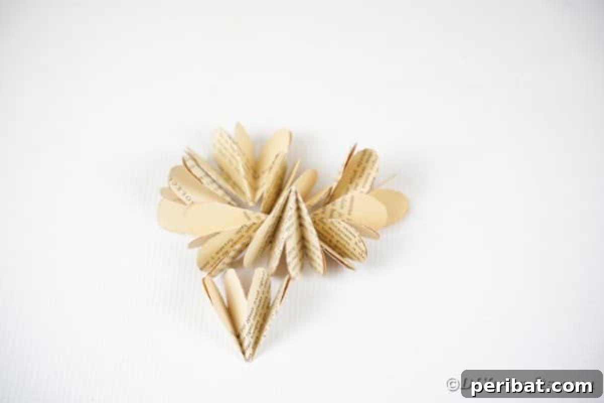 Charming Blooms from Repurposed Book Pages 15 A stack of folded old book page paper petals, ready for assembly