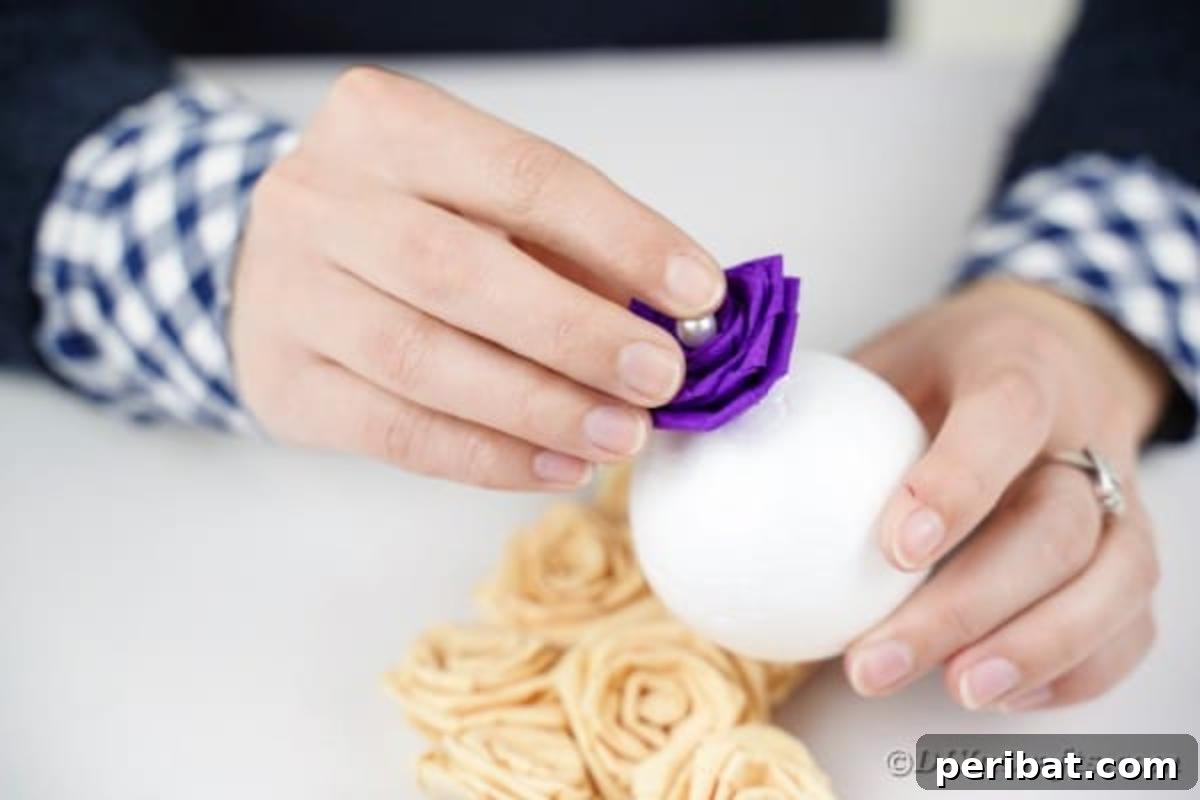 Crafting Elegant Tissue Paper Roses Step by Step 16 Gluing a paper rose to a Styrofoam ball
