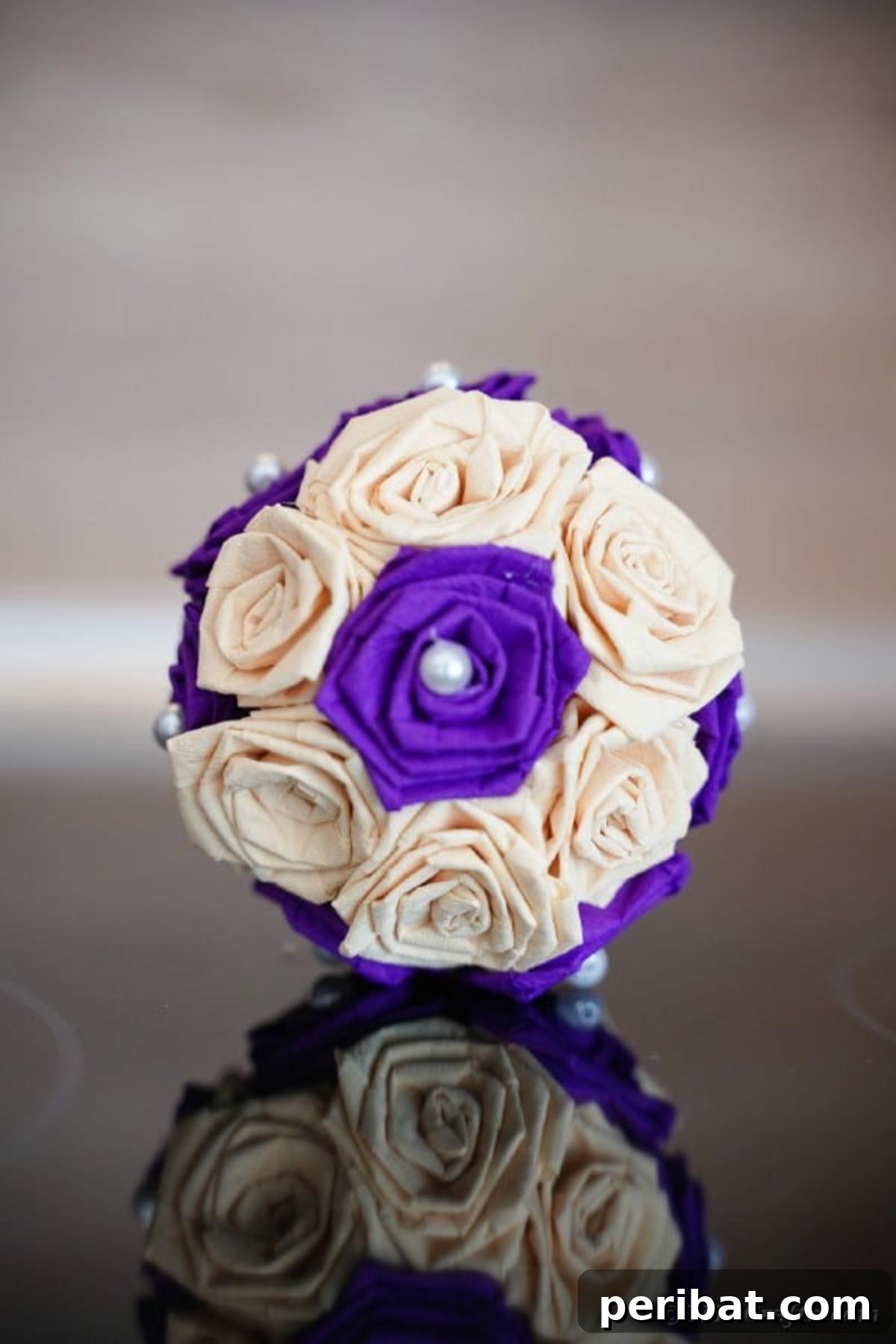 Crafting Elegant Tissue Paper Roses Step by Step 23 Purple and cream tissue paper ball on table