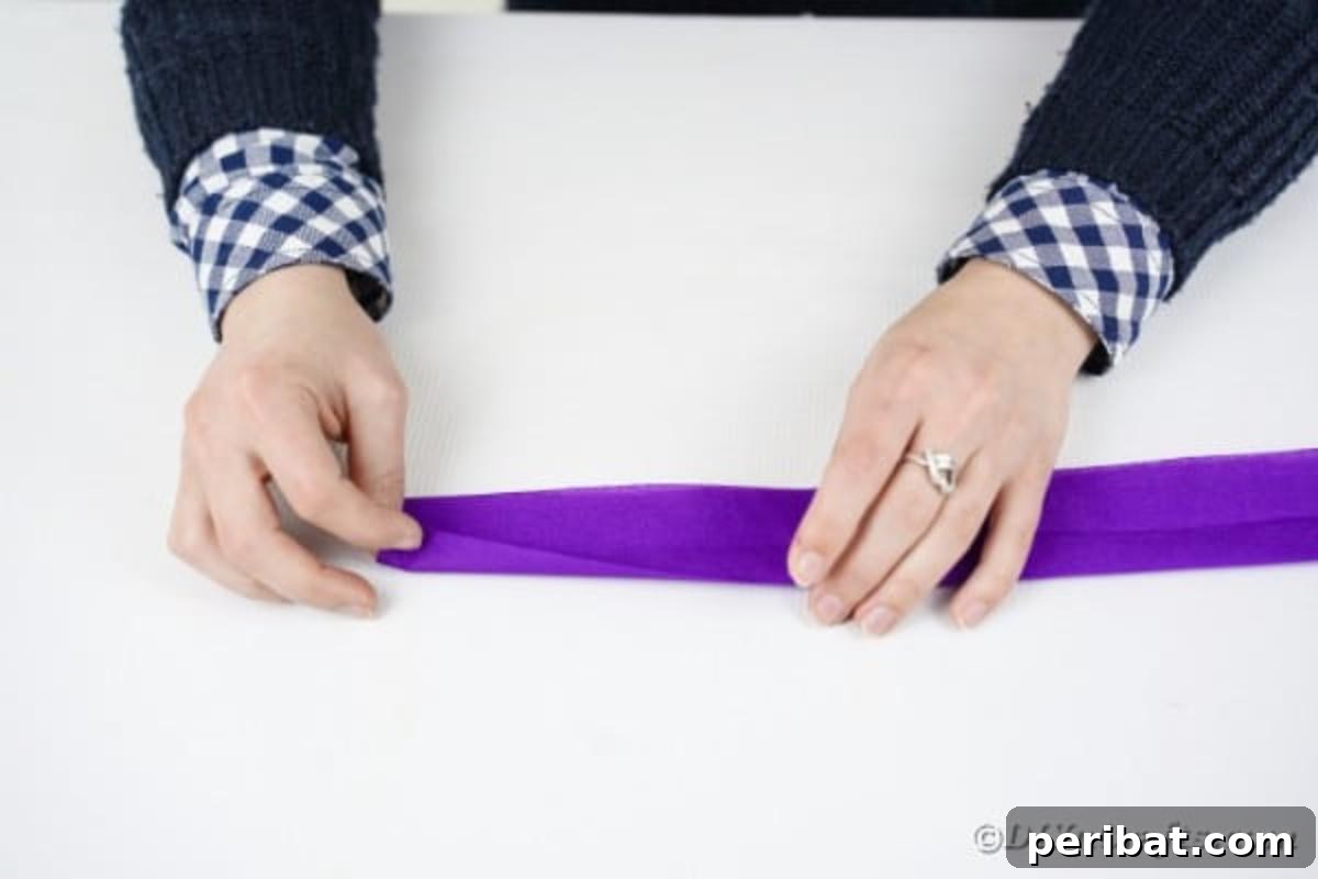 Crafting Elegant Tissue Paper Roses Step by Step 9 Rolling a purple tissue paper rose