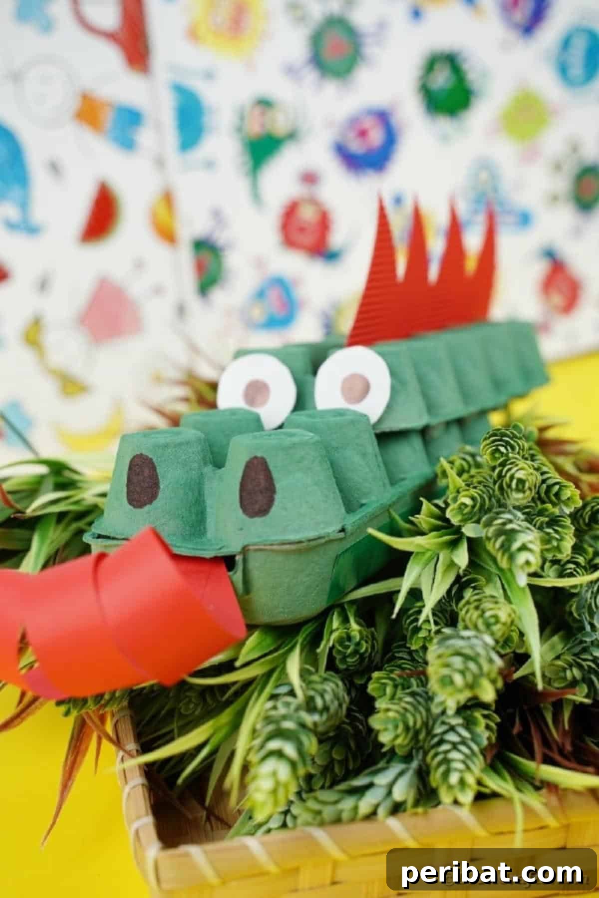 A green egg carton dragon resting on a bed of green leaves, blending with its natural surroundings.
