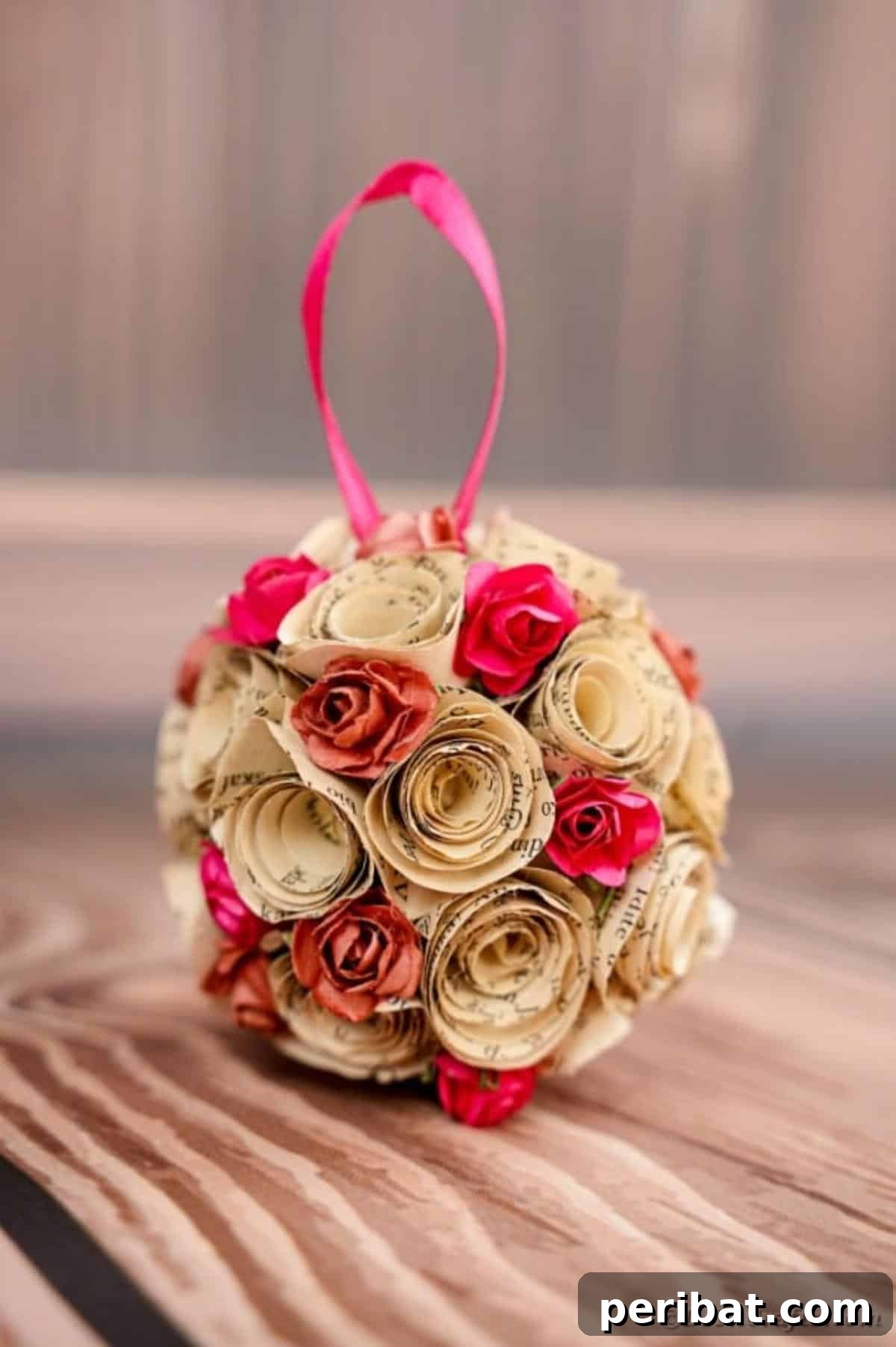 From Pages to Petals: DIY Book Rose Sphere 19 A beautifully completed paper rose ball displayed on a rustic wooden table