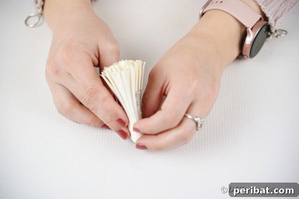 Rolling paper into flower