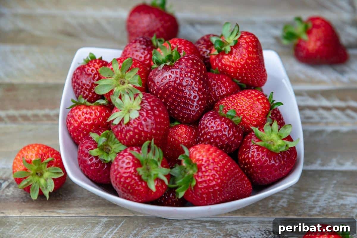 Achieve Perfect Strawberries: 27 Essential Gardening Tips 29 A bowl full of ripe, juicy strawberries.