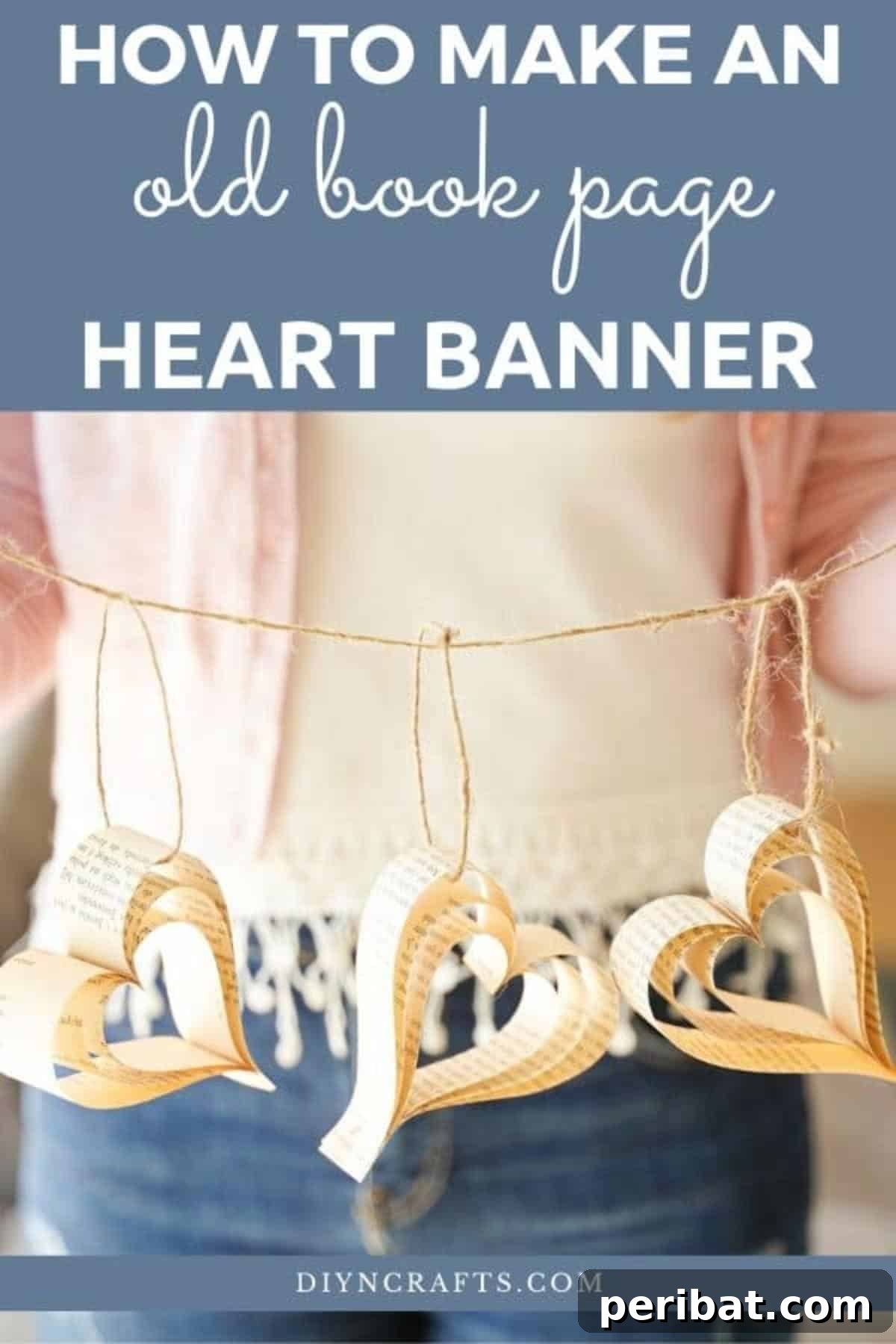 Heirloom Book Page Heart Bunting 2 Woman holding a handcrafted paper heart banner made from old book pages