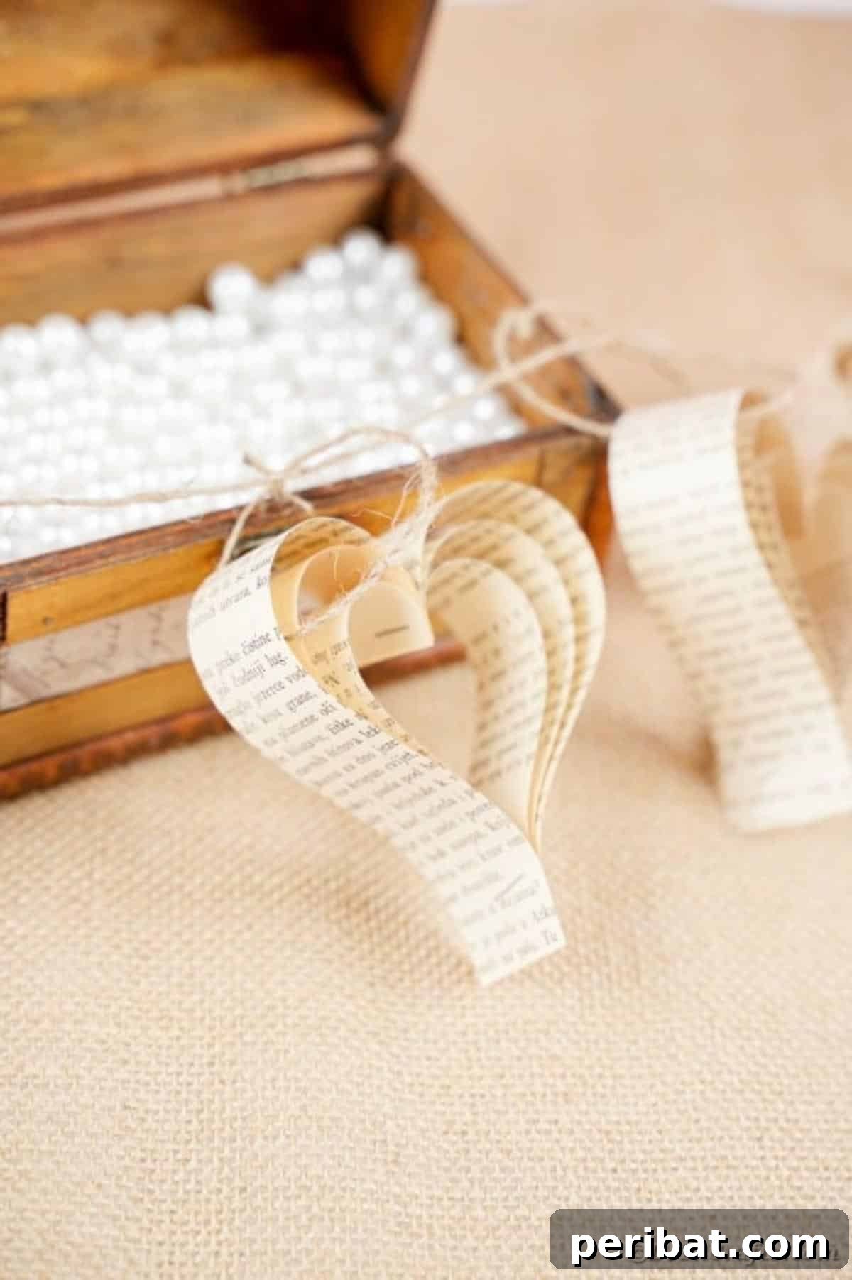Heirloom Book Page Heart Bunting 25 The rustic paper heart banner elegantly laid inside an open antique wooden chest