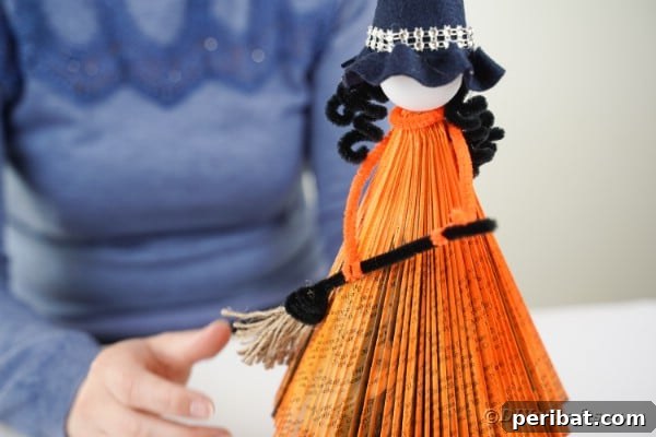 Upcycled Book Floating Witch Halloween Decor 40 Adding broom to witches body