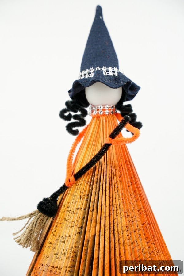 Upcycled Book Floating Witch Halloween Decor 43 Orange paper book witch with white background