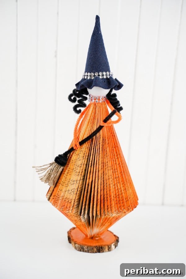 Upcycled Book Floating Witch Halloween Decor 44 Orange paper book witch with white background